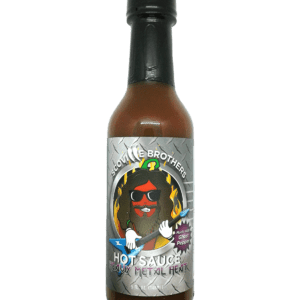 A bottle of hot sauce with an image of a man wearing sunglasses.