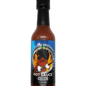 A bottle of hot sauce with a picture of a man on it.