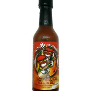 A bottle of hot sauce with the label " chili brothers "